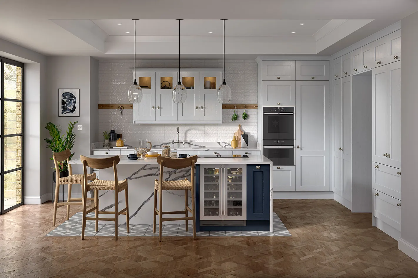 A kitchen with a centre island with a wine cooler.